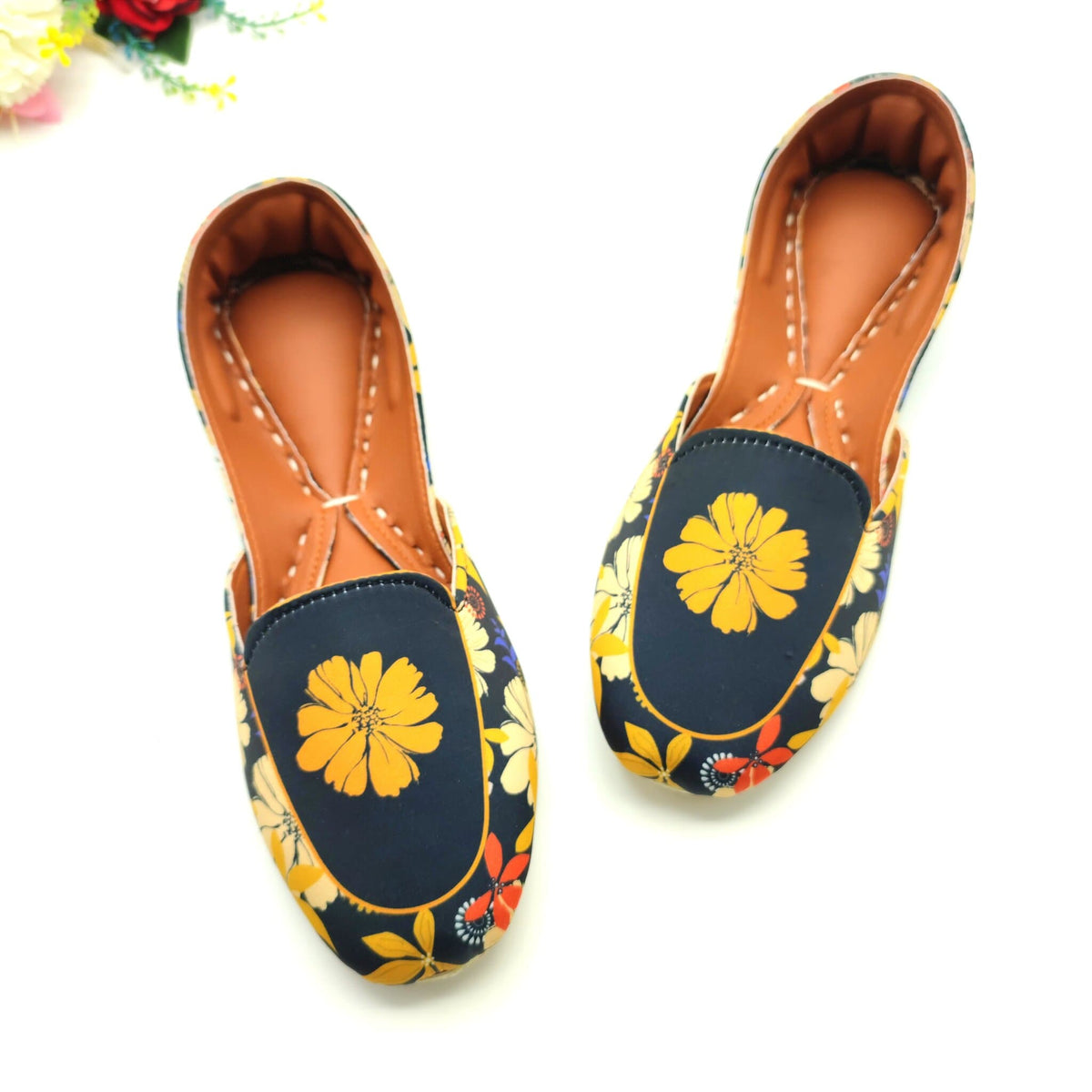 Pair of floral Women loafers Khussa on a white background